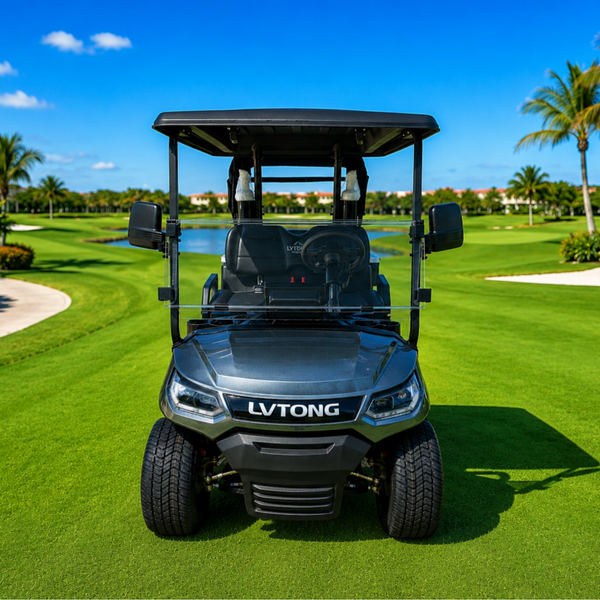 A dark gray LVTONG electric golf cart with a black canopy, positioned on a lush green golf course with palm trees and a blue sky in the background.
