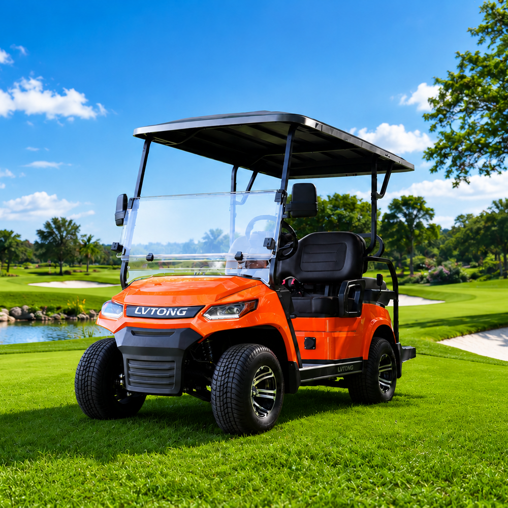 An orange and black golf cart with a clear windshield and black canopy, parked on a lush green golf course under a bright blue sky with white clouds. The brand name 'LVTONG' is visible on the front grille.